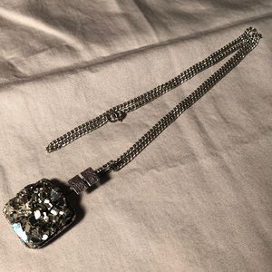 Pyrite gemstone in silver stamped surround